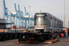 Bombardier FLEXITY Streetcar getting pulled by winch onto special truck and trailer - the only one of its type in North America.