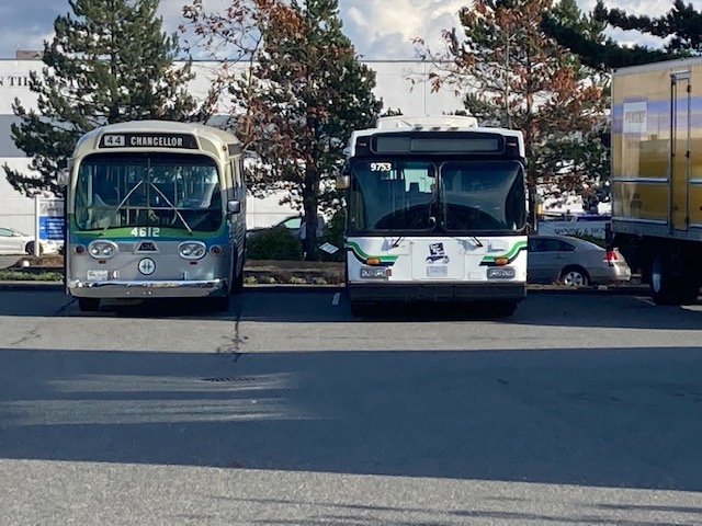 Buses parked in a lot Description automatically generated with low confidence