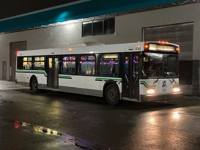 A bus parked in front of a building

Description automatically generated with medium confidence