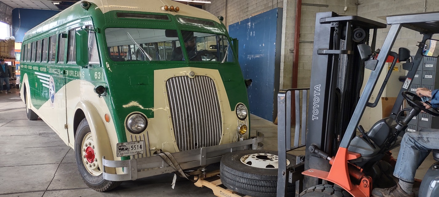 A green truck parked in a garage

Description automatically generated with low confidence